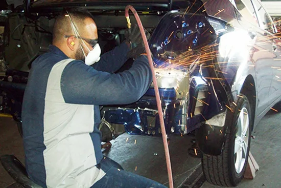 Tom's Auto Body, Inc. repair shop photo 3